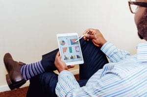 man holding the tablet to organize the move with commercial movers Las Vegas