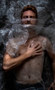 Man wrapped in plastic wrap