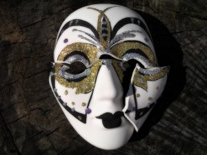 Broken mask - hire professional packers for moving your art collection so that won't happen