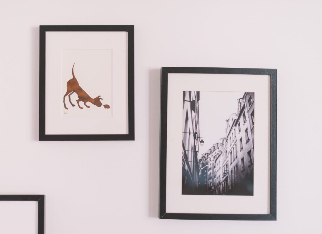 photos on a wall - add art to walls and make your new house feel like home