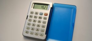 a blue calculator placed on a table