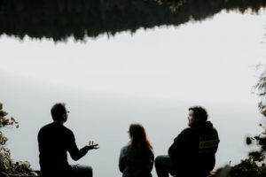 People talking at the lake