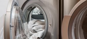 a washing machines with towels inside
