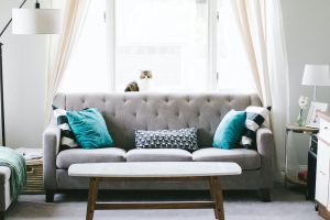grey sofa with blue pillows