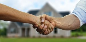 a handshake - Buying a home in Spring Valley