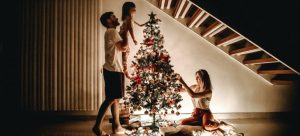 a family settling in after a move and decorating a Christmas tree