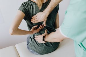 a woman getting a back massage - safety challenges when moving house