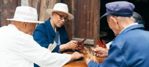 elderly playing games on their moving away party after retirement