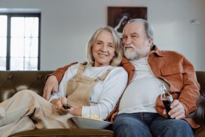 an elderly couple sitting