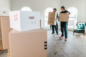two men holding the boxes