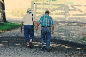 an elderly couple walking