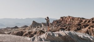 Woman standing on rocks in Death Valley