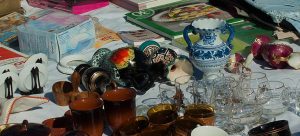 some dishes, books and other small trinkets found on garage sale