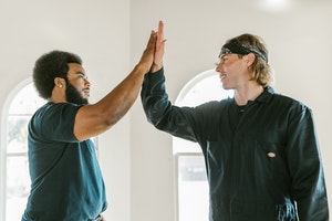 Movers giving a high five to each other