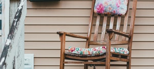 Rocking chair on shabby wooden porch