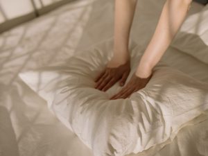 a person holding a pillow