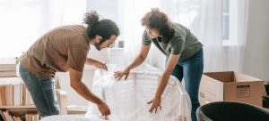 Couple packing furniture