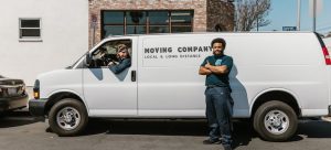 two movers bringing essentials for a commercial move in Henderson
