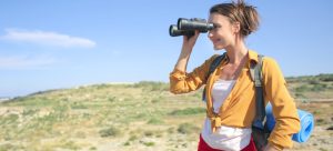 A girl looking through binoculars and enjoying outdoor activities in Las Vegas